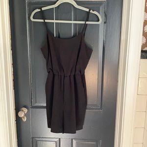 A+O fun & flirty black romper WITH POCKETS!